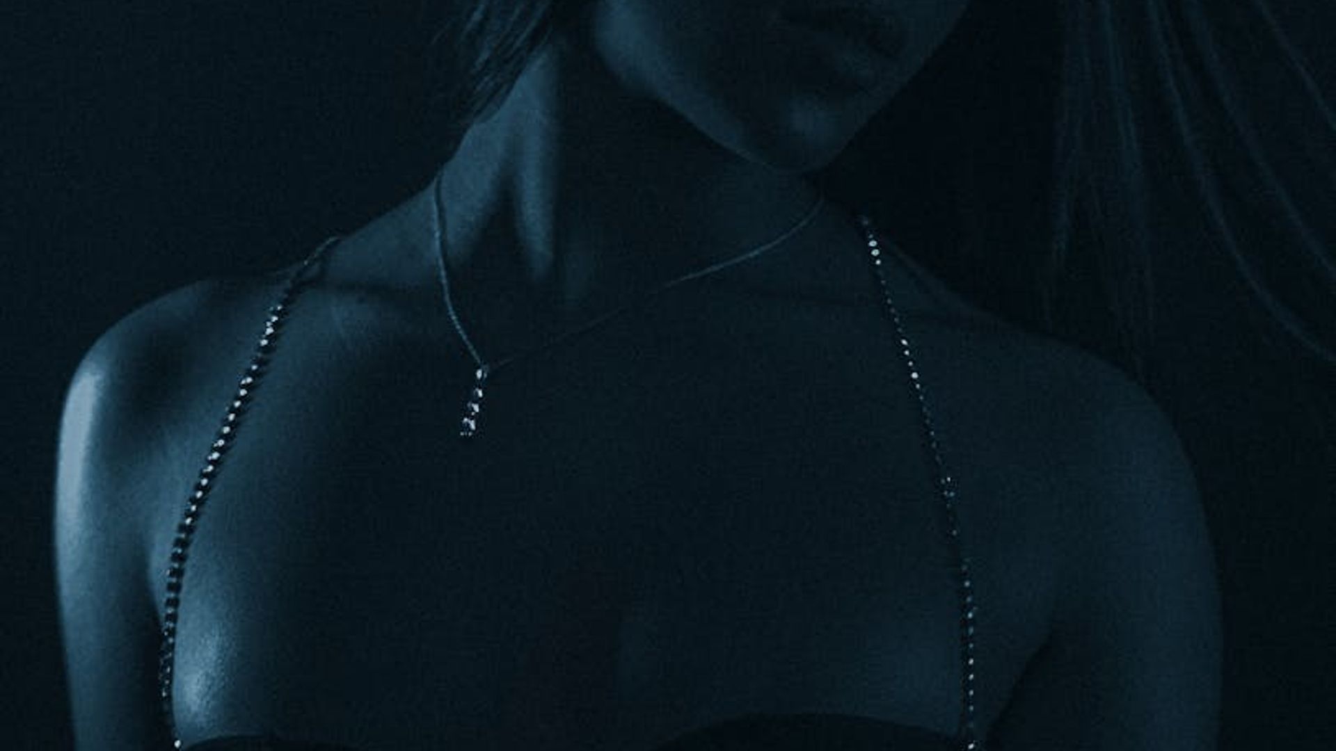 Serene dark fitness studio with subtle neon lime lighting